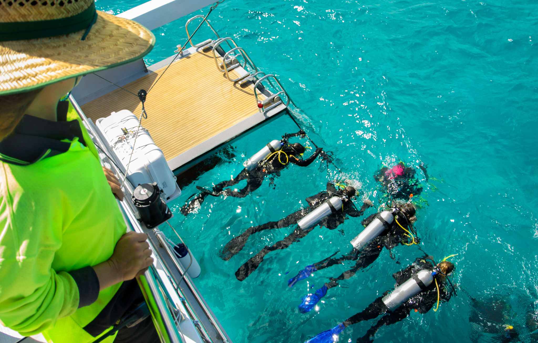 Scuba Divers on Great Barrier Reef Tour Cairns onboard Passions of Paradise Catamaran